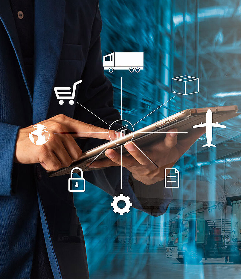 Businessman manager using a tablet to check and control modern warehouse logistics.