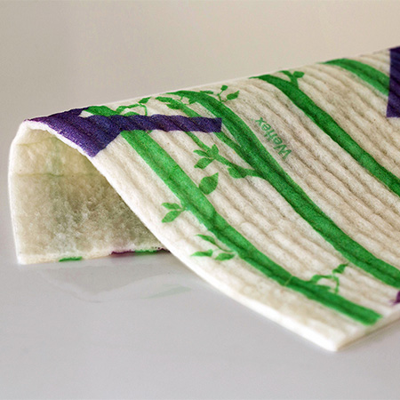 Close up of a white cloth with green stripes