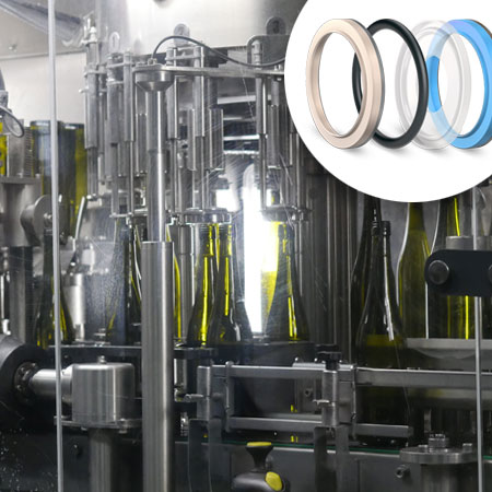 Image of a bottle filling machine with sealing rings in the right corner of the photo