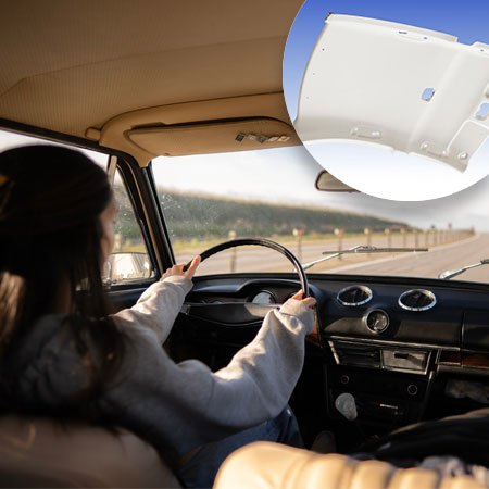 Back view of a woman sitting at the wheel of a car. In the right corner of the image is the product image of the vehicle roof linings.