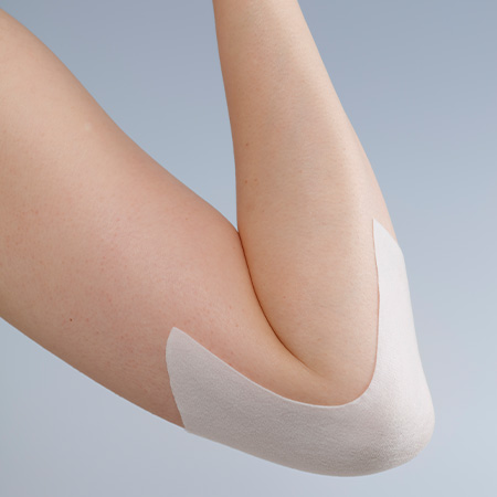 Bent arm with plaster on the elbow