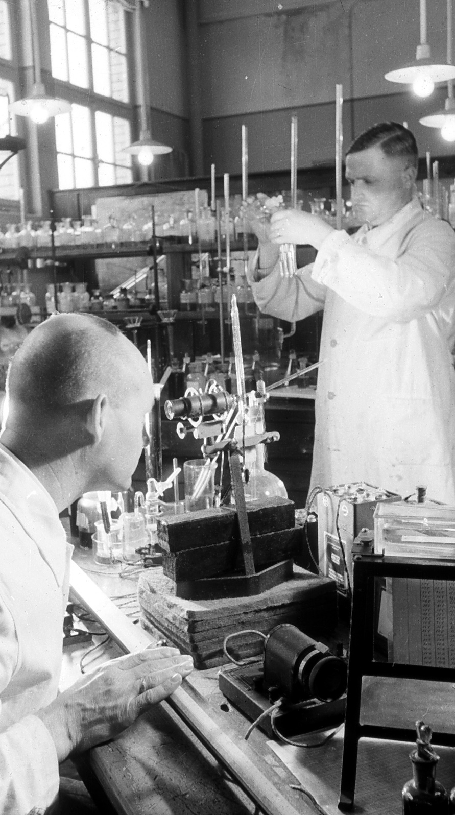 The picture shows two men in a laboratory