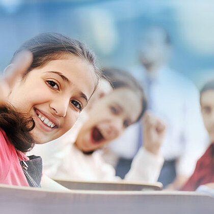 Two girls smiling into the camera