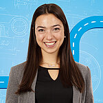 Portrait of a female person shown in the center of the picture against a blue background.