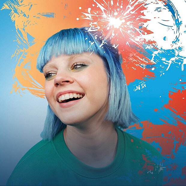 a smiling girl with blue hair with colorful background