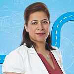 Portrait of a female person shown in the center of the picture against a blue background.