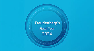 Blue round graphic that has written Freudenberg's Fiscal Year 2024 