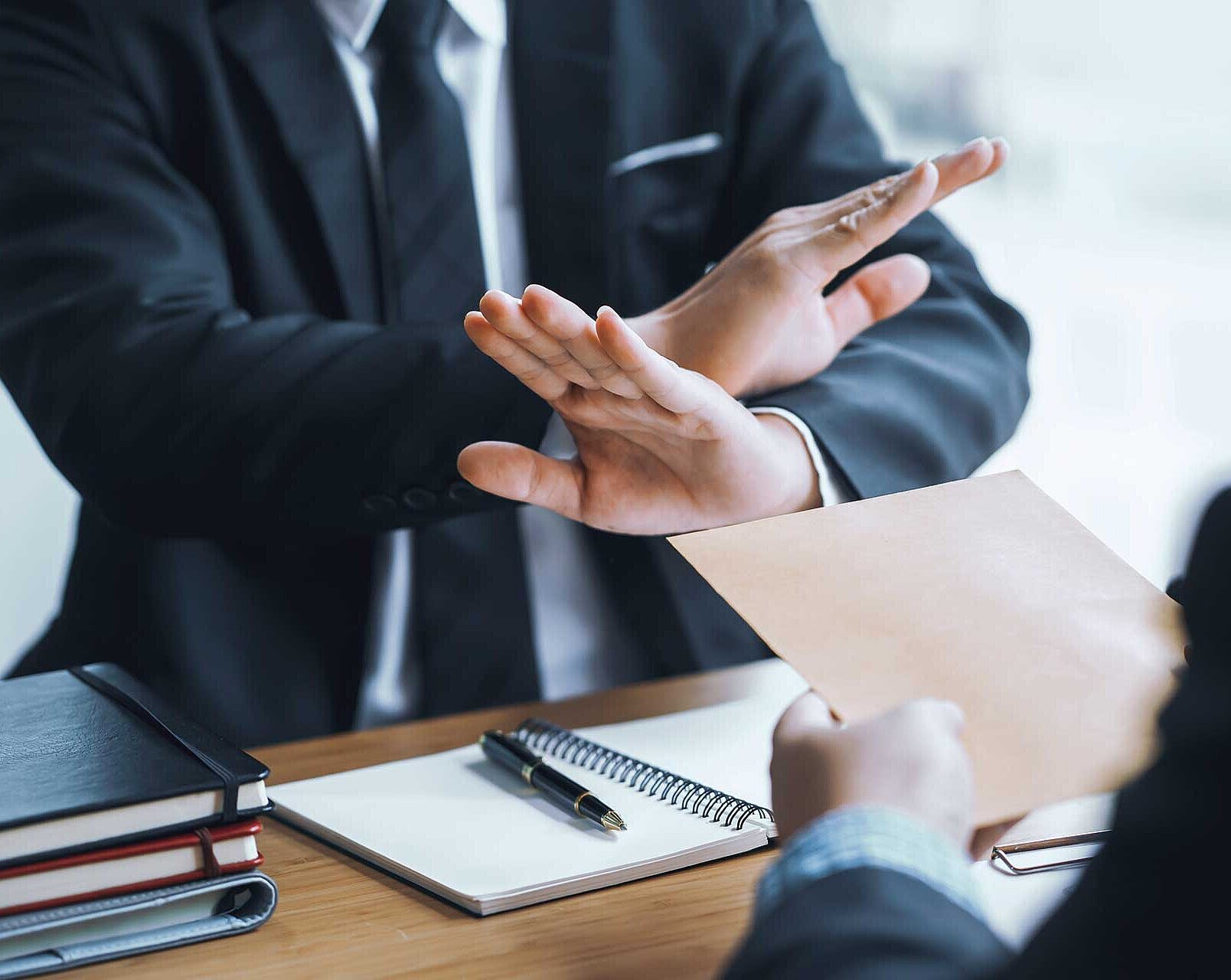 Lawyer refuses to accept bribe from business people in contracting. Corruption and anti bribery concept.