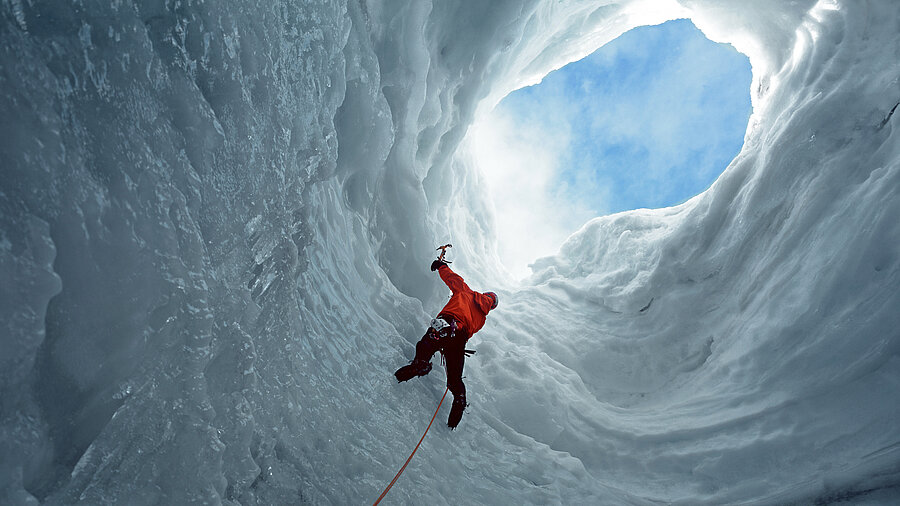 A climber in an ice cave