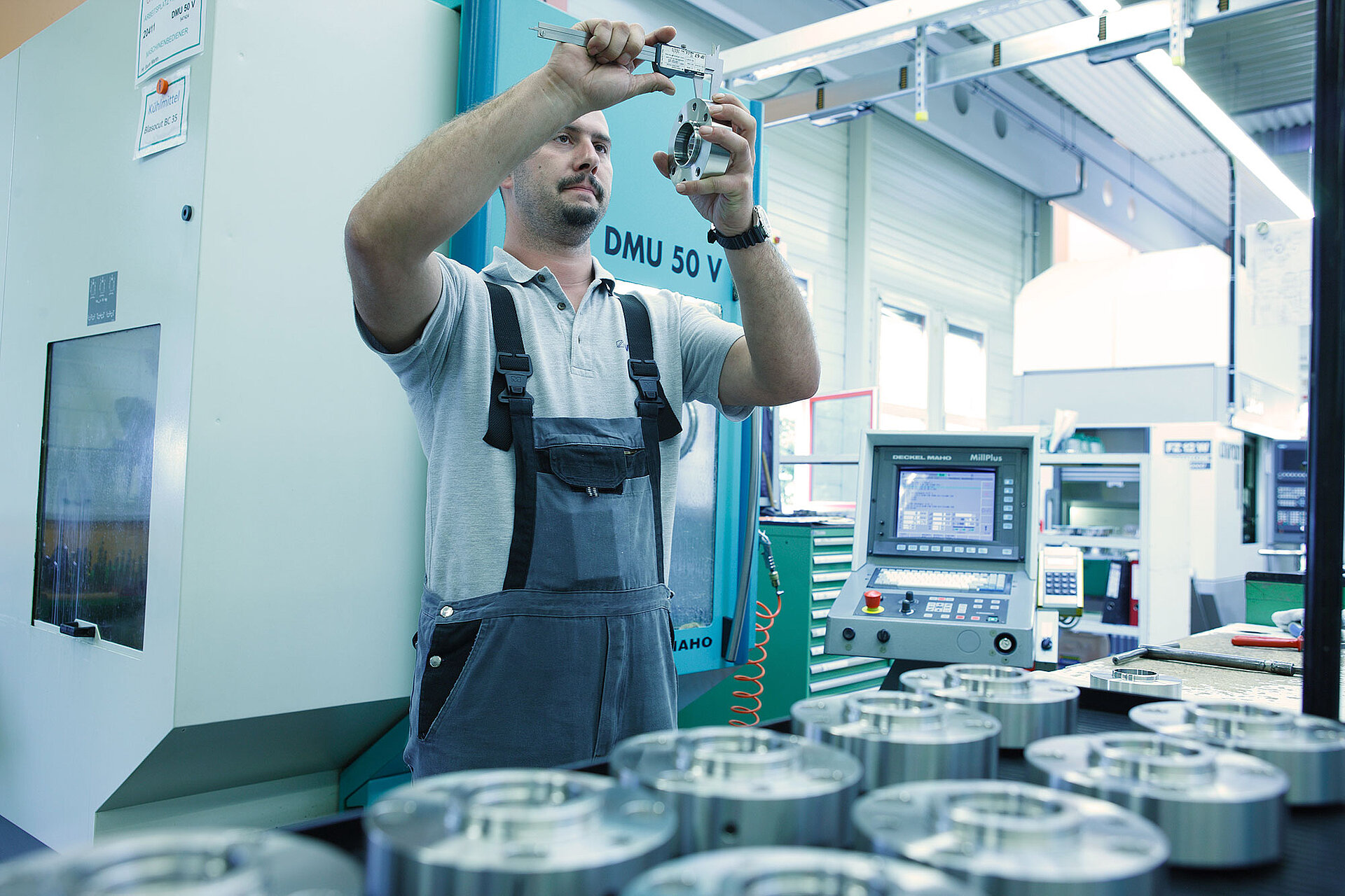 Man checks a sealing system with a caliper.