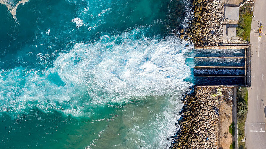 Water flowing out of a water gate into the sea