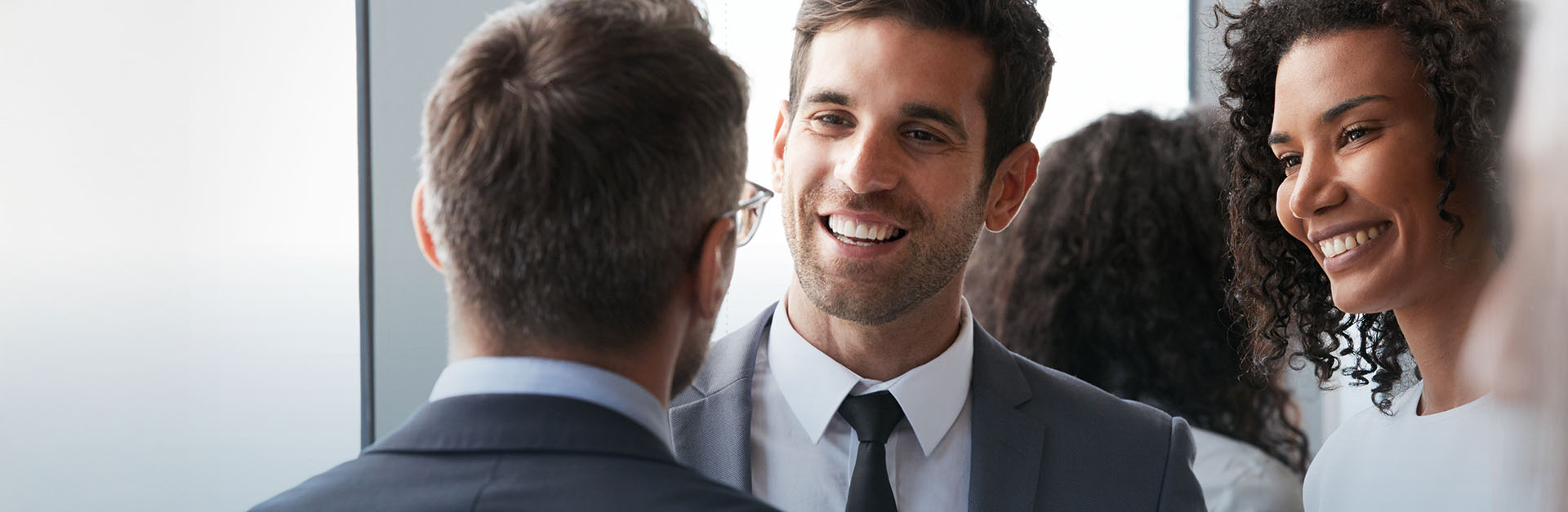 Group Of Businesspeople Having Informal Office Meeting
