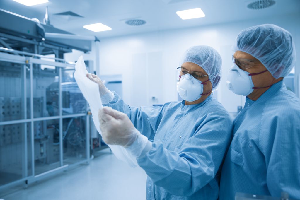 Image of scientists holding scaffolene nonwovens