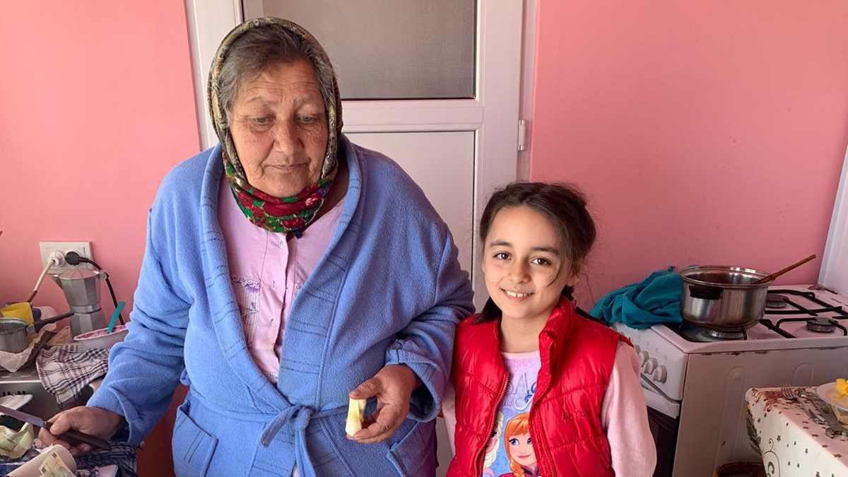 Older woman and girl in a kitchen