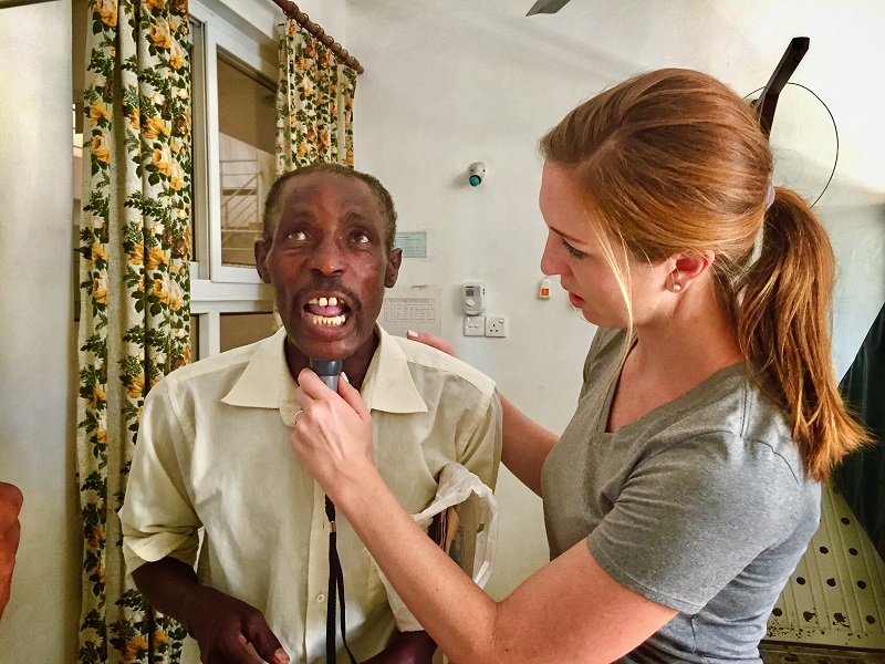 Jennifer Starkweather with a patient 