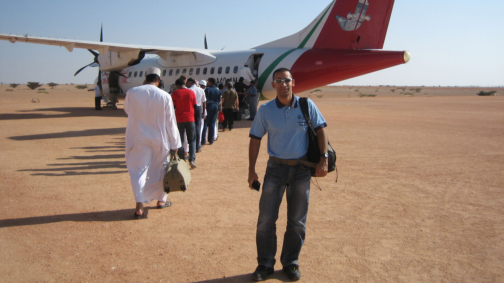 EagleBurgmann Project Development Manager Lorenzo Zabala in front of an airplane