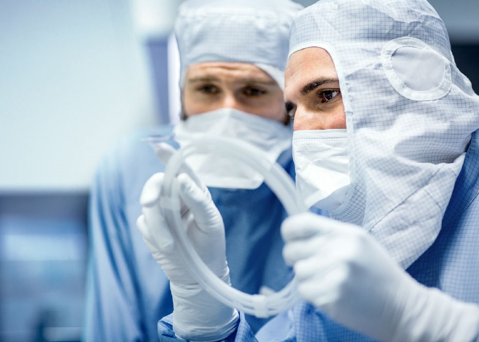 Freudenberg employees inspect the quality of a balloon catheter