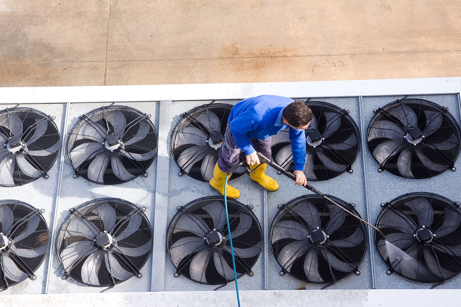 Man cleaning a machine